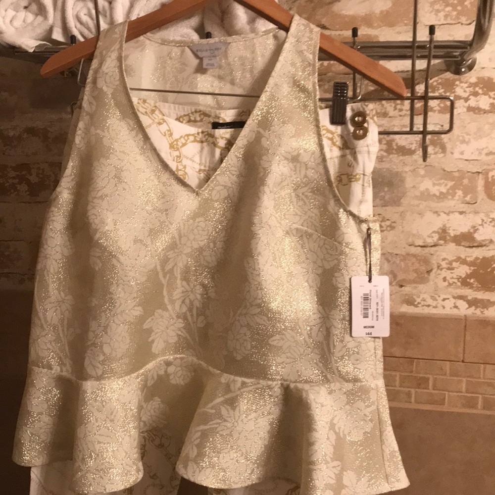 A top size medium and a pair of chains pants